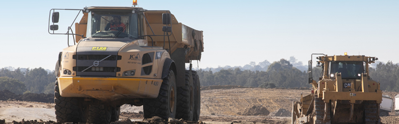 Earth moving trucks on a construction site