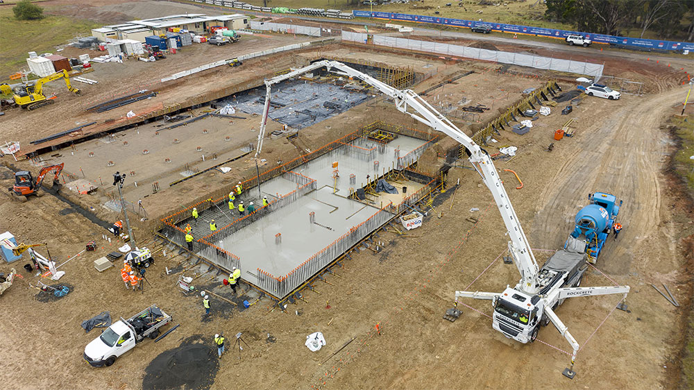 An aerial view of the concrete slab pour at a the site of the First Building.