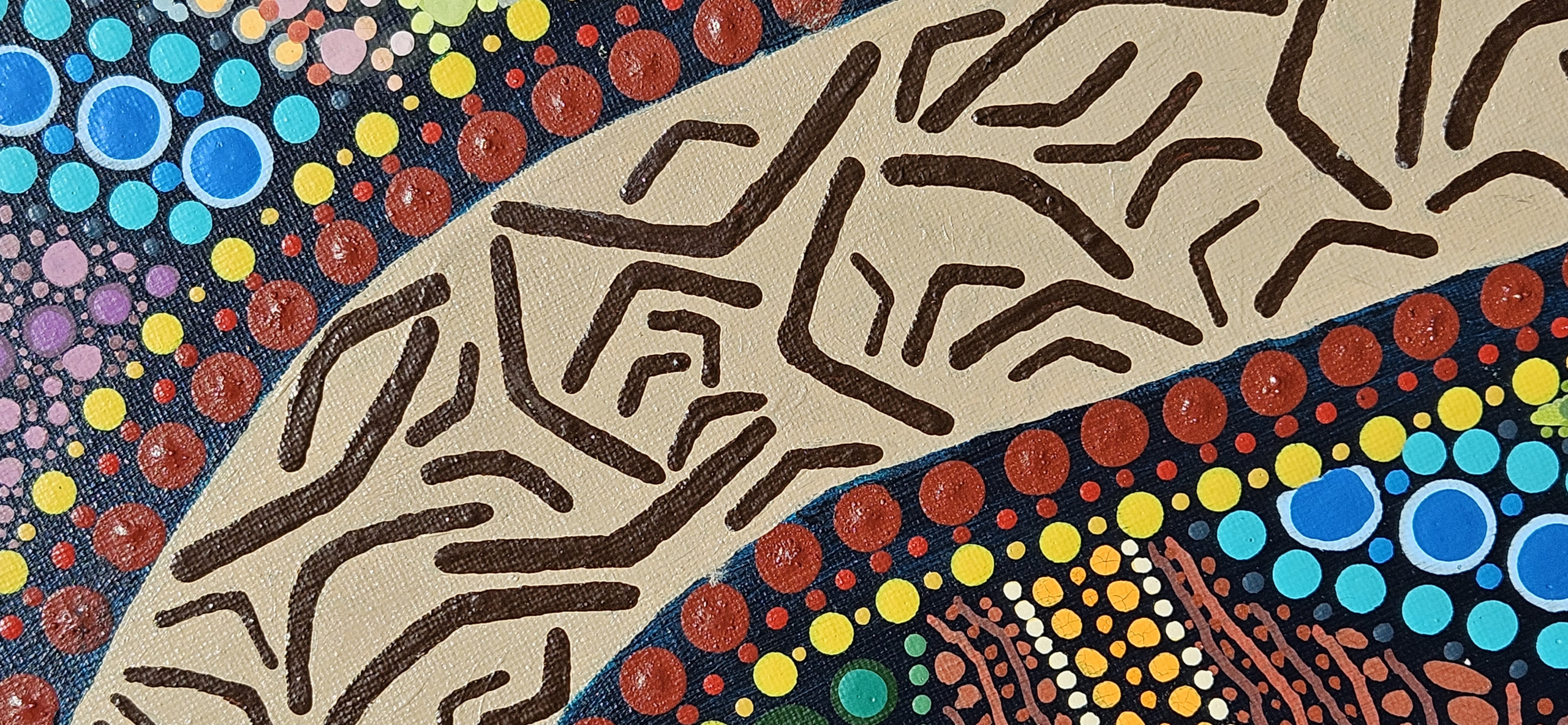 Close up detail of Indigenous artwork of a boomerang